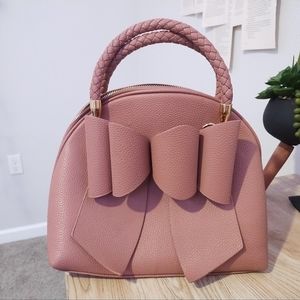 Maroon purse with bow in the front